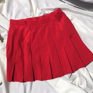Red pleated mini skirt